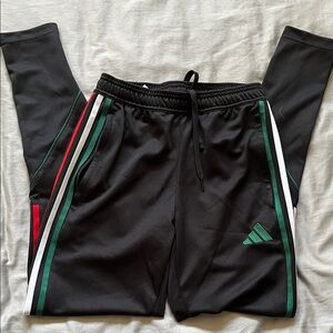 Adidas Men's Black Joggers with Green and Red Stripes